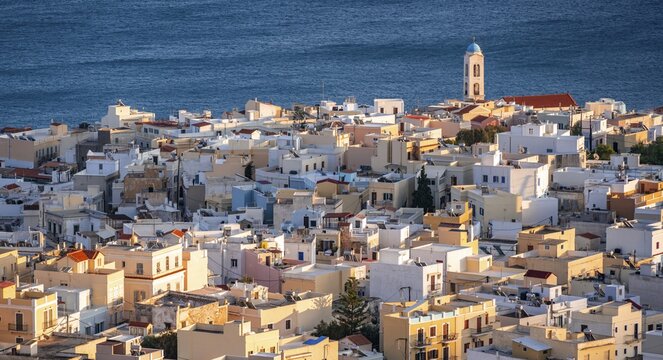 Ermoupoli houses, evening light, sea, Syros, Cyclades, Greece