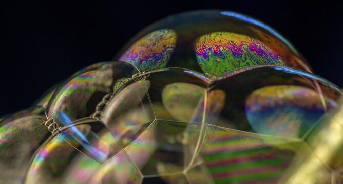 Soap bubbles, foam, light reflected in all colours