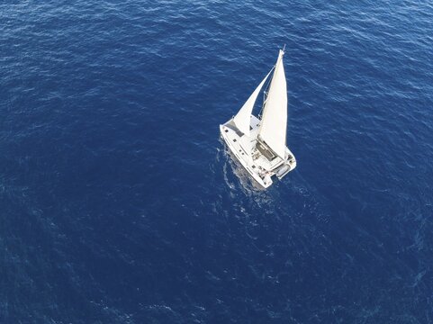 Sailing catamaran in full sail, sailing on the sea, South Aegean, Greece