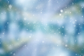 Fototapeta premium blurred snow / winter abstract background, snowflakes on abstract blurred glowing leaf background