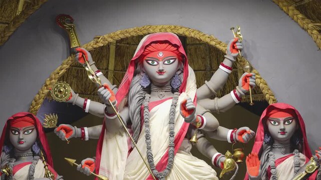 Detailed close shot of Maa Durga face during Durga Puja highlighting eyes, colors, and powerful divine expression.