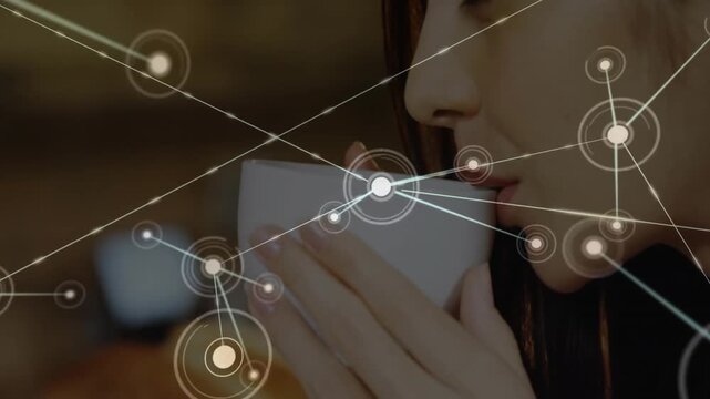 Woman holding ceramic cup near lips in tech scene, featuring glowing data network overlay