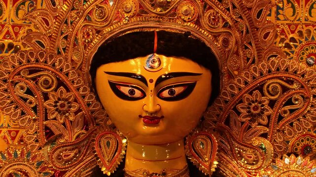 Close-up view of Durga Devi face during Durga Puja showing divine expression, vibrant colors, and spiritual energy of the festival.