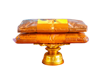 Kathin fabric, Kathin ceremony, Buddhist monk dresses in a carved tradition pearl tray with clipping path on isolated background