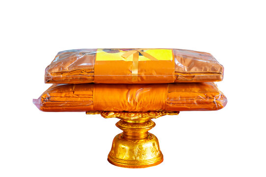Kathin fabric, Kathin ceremony, Buddhist monk dresses in a carved tradition pearl tray with clipping path on isolated background