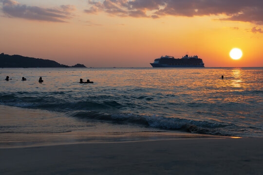 Beautiful view of vibrant sunset at the Patong beach on Phuket island, Thailand.