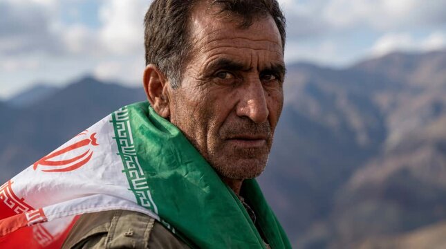 Iranian Man Standing on a Mountain with National Flag