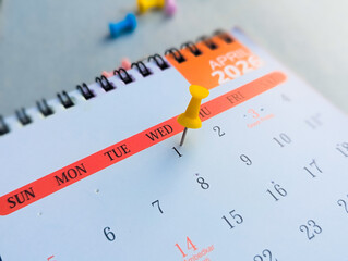 Yellow pushpin on April 1st 2026 calendar for April Fools' Day schedule