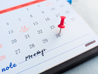 Fototapeta premium Red push pin mark on last day 30th date on calendar 2026 deadline concept