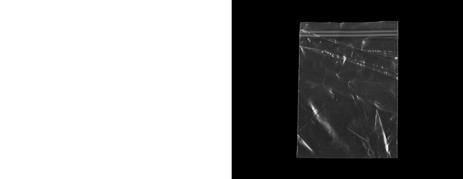 Clear plastic ziplock bag on transparent and black background isolated.