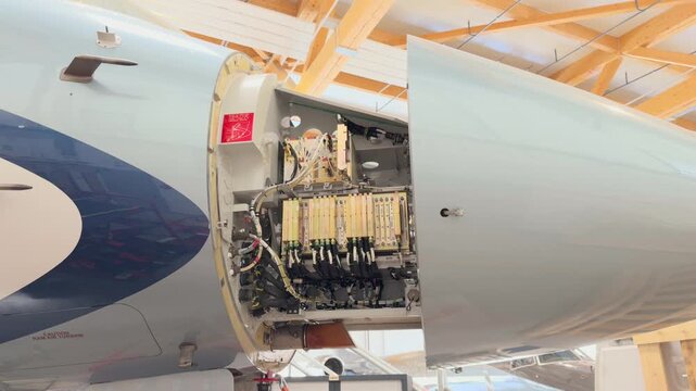 Open Forward Avionics Bay Private Jet Airplane in Maintenance Hangar