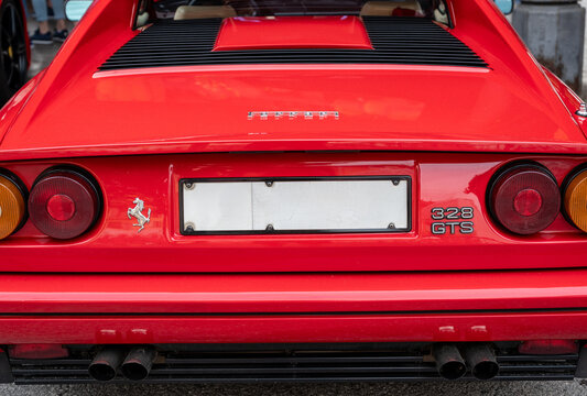 Mondov&igrave; (cuneo), italy, july 21, 2024. Ferrari rally. Red ferrari 328 gts rear view with iconic prancing horse emblem, showcasing vintage automotive design and power