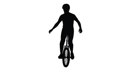A cyclist riding a unicycle captured in stark black silhouette © AL-AMIN
