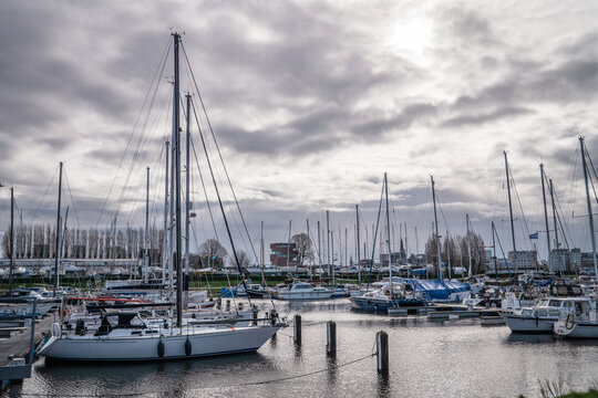 Sailboats moored in Antwerp marina with a view of the MAS Museum, Belgium