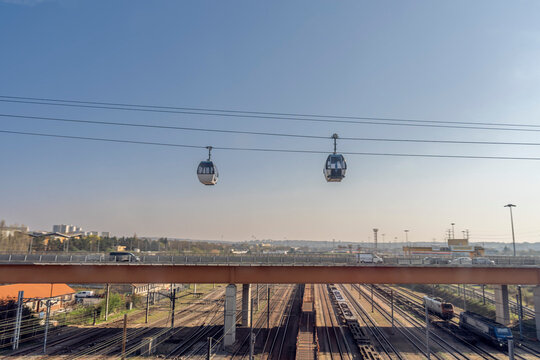 Paris, France - 03 19 2026: View The first cable car in &Icirc;le-de-France and its gondolas above the road and rail lines