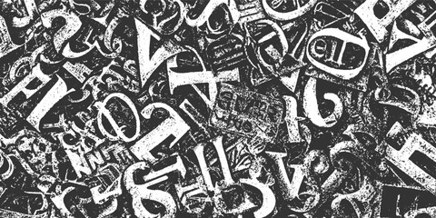 Chaotic jumble of distressed white gothic alphabet letters on a dark textured background font typography © appl