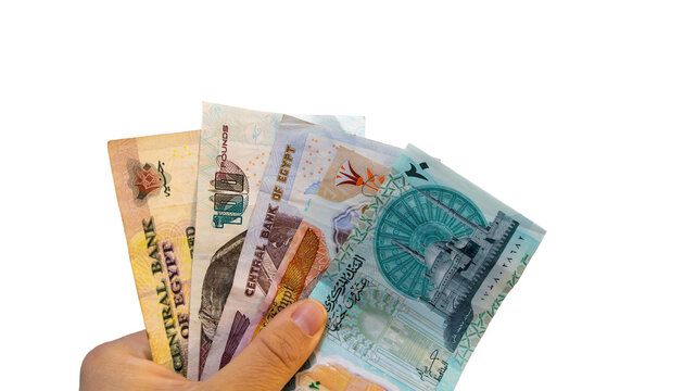 Isolated Hands holding egyptian pounds banknotes, representing egyptian currency, inflation, and financial concepts