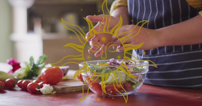 Animation of sun icon over hands making healthy salad