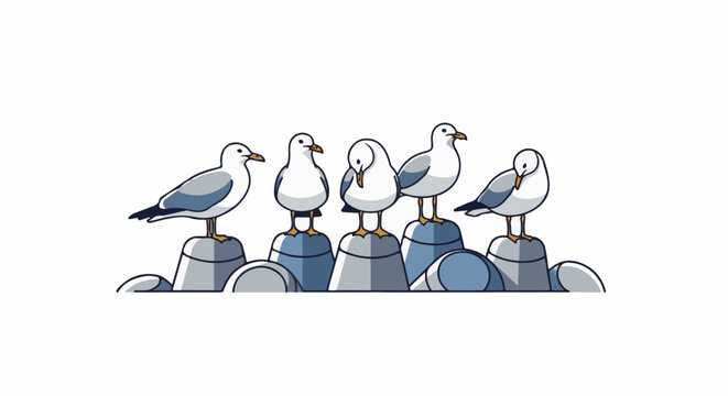 Five white and gray birds perch on stacked rocks along a shore