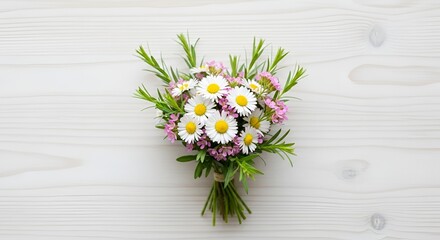 Obraz premium Bouquet of white daisies and pink flowers on a rustic wooden table
