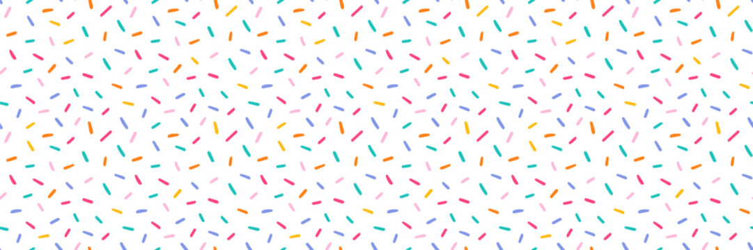 Seamless cute pattern with colorful hand drawn sprinkles and confetti. Sweet pastel texture inspired by donuts, cupcakes, candy. Childlike abstract background for birthday, kids party, fabric, print