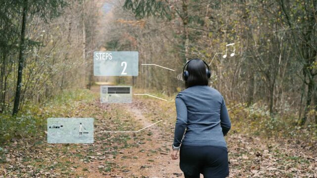Woman putting on headphones and starting to run on an autumn forest trail with augmented reality fitness interface data overlay