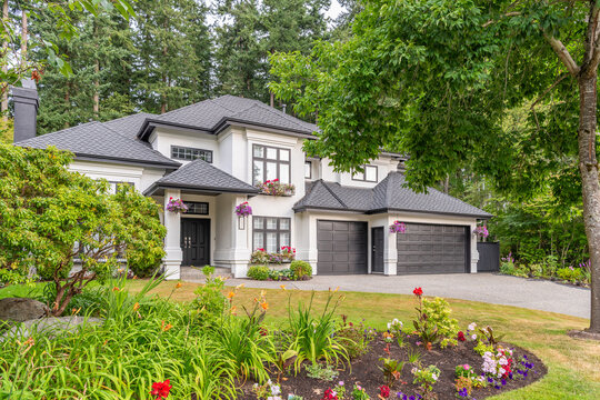 Two story luxury house with beautiful summer  landscape in Vancouver, Canada, North America. Day time on August 2025.