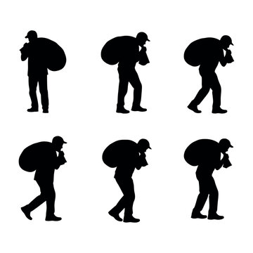 Set of silhouettes of a man carrying a sack on his back