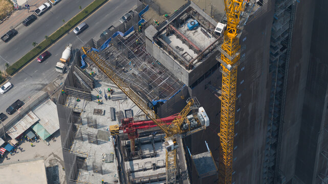 Copacabana, Thailand - 10 February 2026: Aerial view of Copacabana Coral Reef residential building construction, a symphony of steel and concrete against a backdrop of bustling city streets.