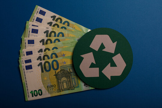 Euro banknotes with recycle symbol, representing green finance, eco-friendly economy and sustainabil