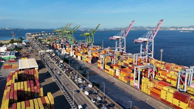 Aerial view of docks area full of containers loading to the ship in Rio de Janeiro city and the bridge crossing Guanabara bay
