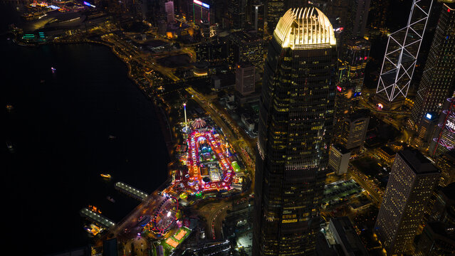 Hong Kong, Hong Kong - 13 February 2026: Aerial view of the dazzling International Finance Centre piercing the night sky, its illuminated peak a beacon above the vibrant cityscape.
