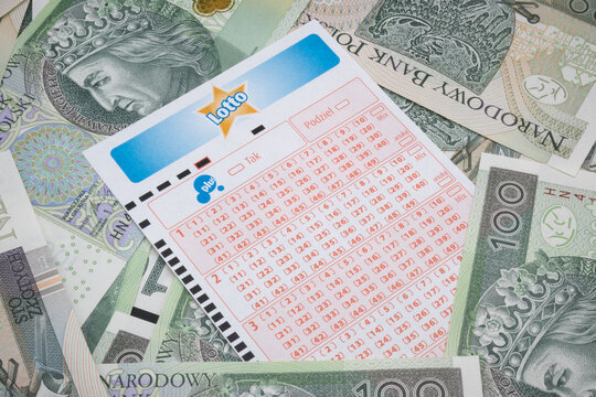 Lotto ticket against the background of Polish money.
