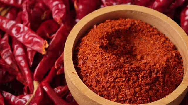 Chili powder in a wooden bowl.	
