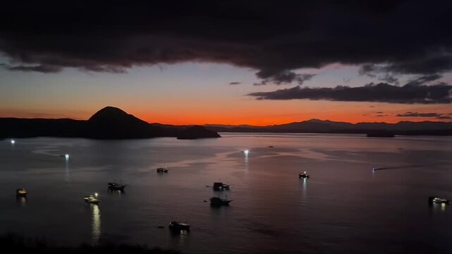 Sunset Over Labuan Bajo Harbor with Fishing Boats in Flores, Indonesia