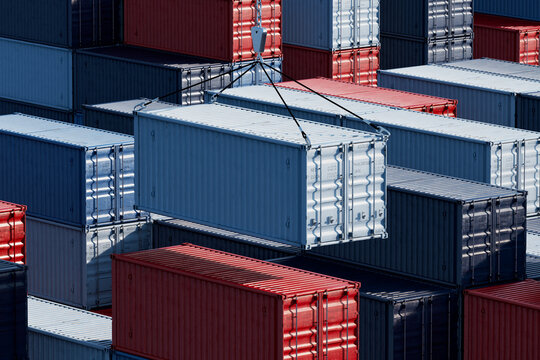 3D suspended container lift above stacked cargo in port yard