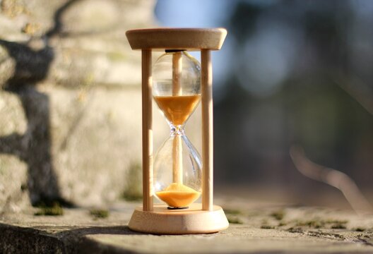 Old park and hourglass time is passing concept hurry up be in time old and modern	

