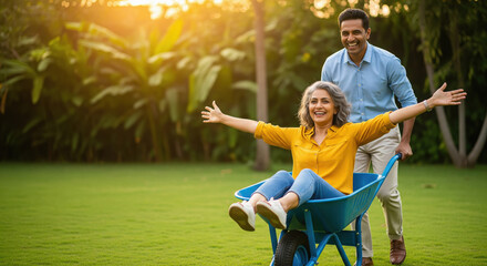 Joyful man pushes woman in wheelbarrow, outdoor fun.