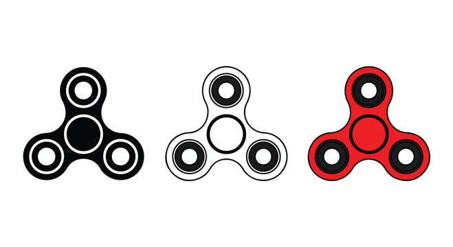 Close-up of three colorful fidget spinners in red, black, and white with spinning motion on a plain background