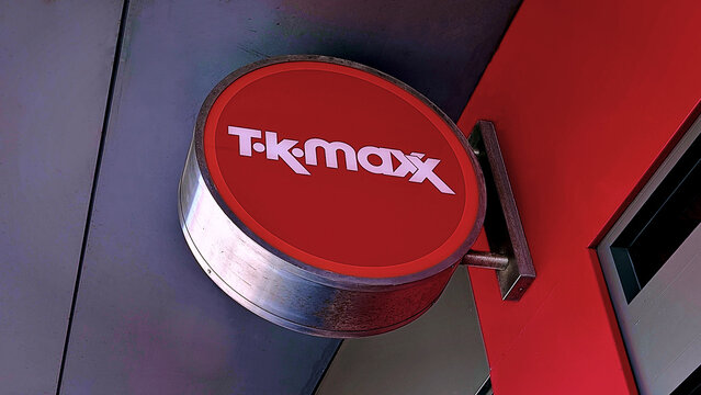 Leicester, England, UK - 21 March 2026: TK Maxx round logo sign, red retail storefront signage, circular shop billboard, fashion brand identity, outdoor department store brand display