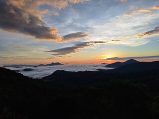 Obraz premium Sunrise Horizon Over Mountains With Sea of Clouds and Soft Morning Light