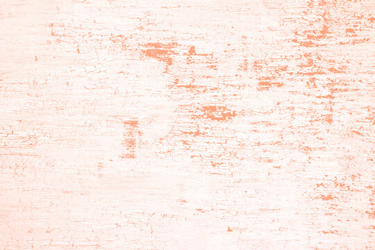 Vintage distressed peach paint peeling off white wood surface texture background