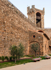 Fototapeta premium Montalcino fortress wall and medieval bell tower in Tuscany, Italy.