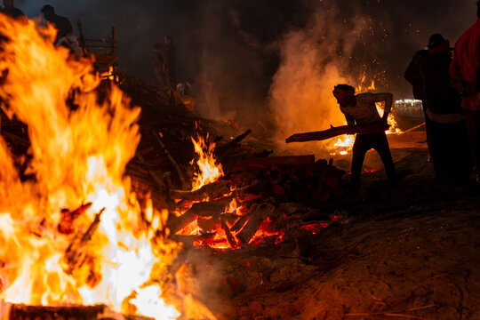 Funeral pyre burning at Manikarnika Ghat during cremation in Varanasi