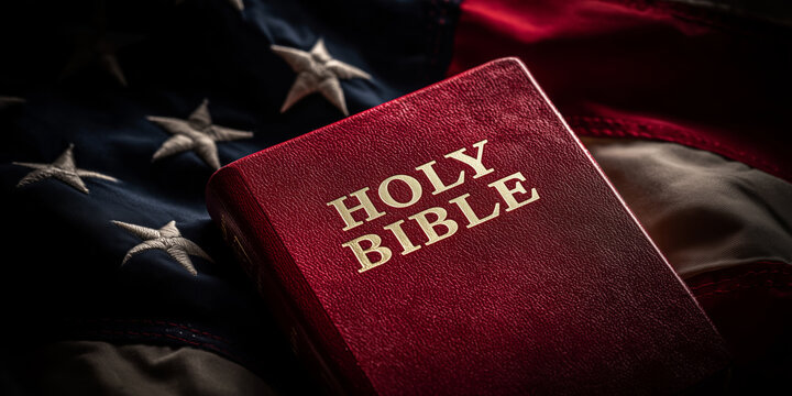 Red Holy Bible resting on an American flag symbolizing faith and devotion