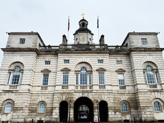 Naklejka premium Historic Horse Guards government building with clock tower and arches in London UK classical architecture facade