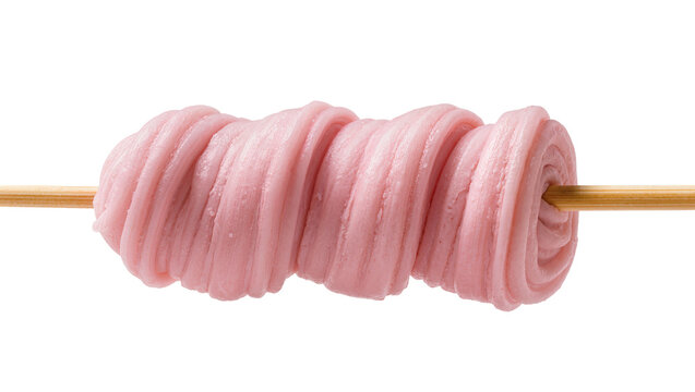 Sweet pink fluffy candy roll on a wooden stick, isolated on transparent background