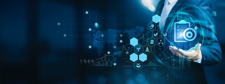 Industry professional holding reports. Assessment evaluates performance, risk, and compliance using structured analysis to support accurate decision-making.