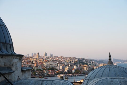 Istanbul cityscape behind the domes of Suleymaniye Mosque in Istanbul, Turkey, June, 2025. Panaromic view of Istanbul skyline behind the domes of Suleymaniye mosque, showcasing Ottoman architecture.