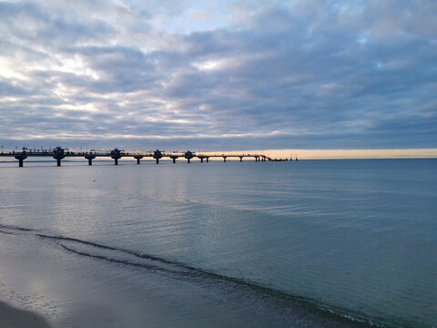 Beach with Pier, Sand and Surf, Morning Light